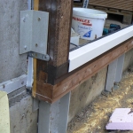 Composite anchors for windows and doors in passive houses - GRP L profiles