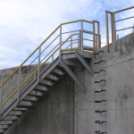 All-composite staircase with platform; wall-anchored