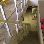 Construction of composite railings top anchored in concrete stairs